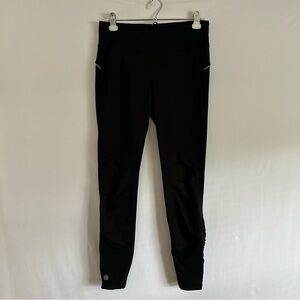 Athleta Wind Warrior Black zipper on the ankle Leggings Womens M